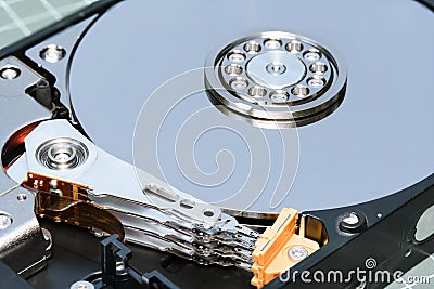 Spindle and plate opened hard disk drive HDD. Stock Photo