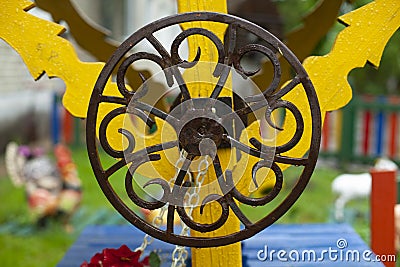 Spindle wheel. Metal circle. Round wrought iron. Well handle Stock Photo