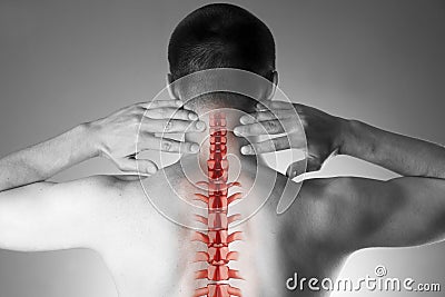 Spine pain, man with backache and ache in the neck, black and white photo with red backbone Stock Photo