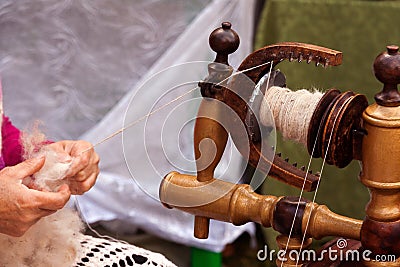 Spinner hands spindle Stock Photo