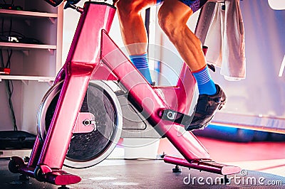 Spinning class, group activity on stationary bike. Team cardio excercise on bicycle. Stock Photo