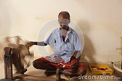 Weaving or Handloom Industry in India. Textile handicraft artisans. Spinning Cotton into thread. Editorial Stock Photo
