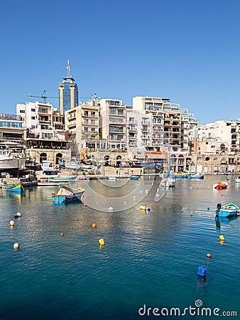 Spinola Bay, St Julians`s Malta with Portomaso tower in the background Editorial Stock Photo