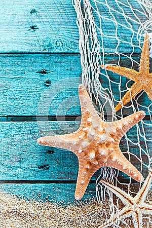 Spiny starfish on turquoise painted boards Stock Photo