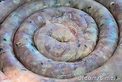 Spiral blood sausage texture in raw condition prepared for barbecue or oven. Stock Photo