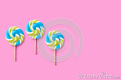 Spiral candy colorful lollipop round on colored background, birthday, birthday Stock Photo