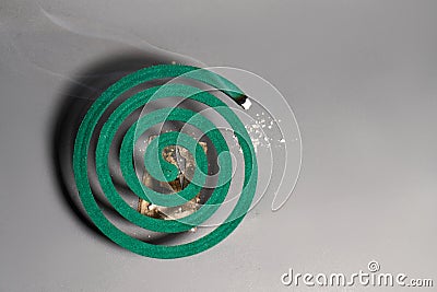 Spiral green Mosquito coils on gray background Stock Photo