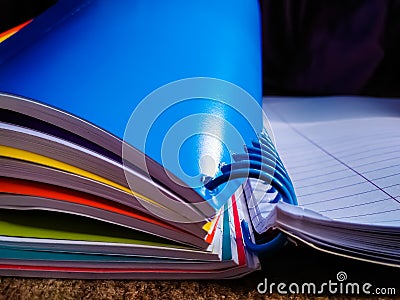 Spiral notebook with different colored sections captured creatively Stock Photo