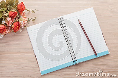 Spiral notebook on wood background Stock Photo