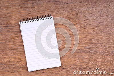 Spiral Notepad on wooden table Stock Photo