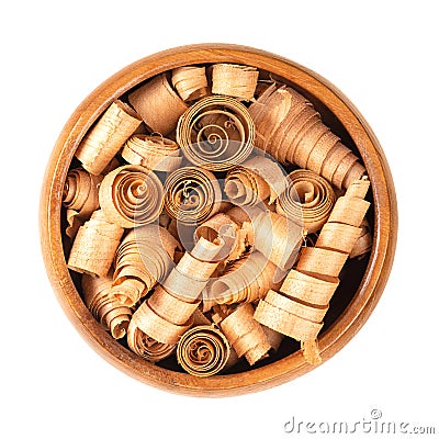 Spiral shaped wood shavings of Swiss pine wood, in a wooden bowl Stock Photo