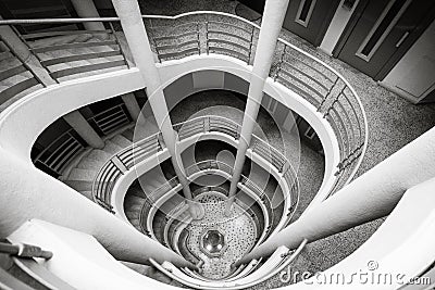 Spiral staircase climbing down, black and white Stock Photo