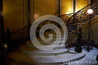 A spiral staircase in the house of the Eliseev brothers Stock Photo