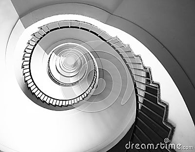 Spiral staircase seen in perspective with the steps going towards infinity Stock Photo