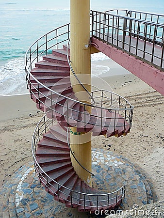 Spiral staircases on the beach of the bay of Cadiz, Andalusia. Spain. Stock Photo