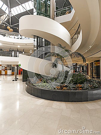 Spiral stairway and glass elevator in Westfield Belconnen Shopping Centre in Canberra, Australia Editorial Stock Photo