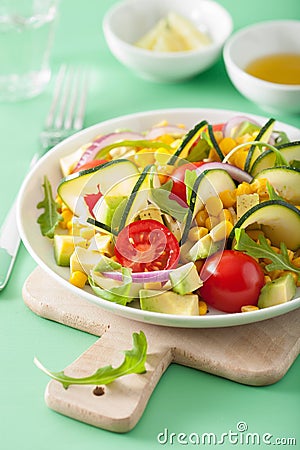 Spiralized courgette salad with sweetcorn tomato avocado, health Stock Photo