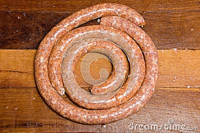 Spiralled spicy raw sausages Stock Photo