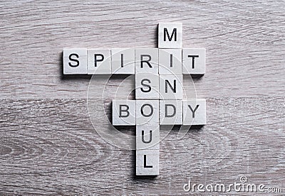 Spirit soul mind and body words made of wooden cubes Stock Photo