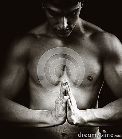 Spiritual concentration - muscular man doing yoga Stock Photo