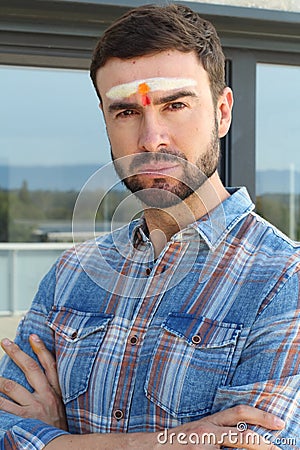 Spiritual man with third chakra painted on forehead Stock Photo