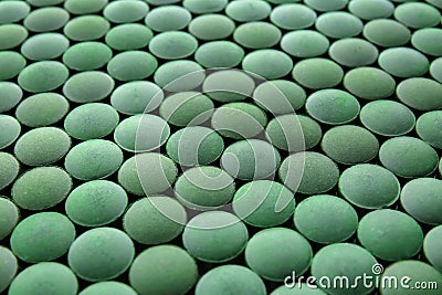 Spirulina tablets, closeup Stock Photo