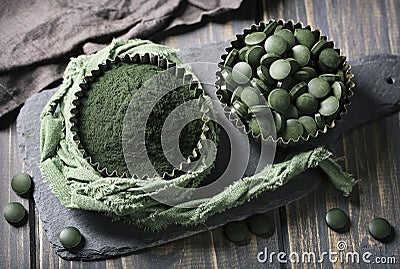 Spirulina tablets and powder Stock Photo