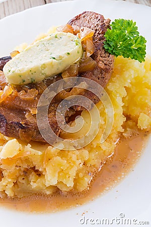 Spit roasts with braised onions Stock Photo