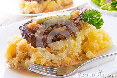 Spit roasts with braised onions Stock Photo