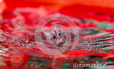 Splash of Red Color Water Drop Stock Photo