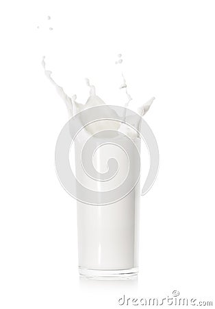 Splash of fresh milk in a glass cup Stock Photo