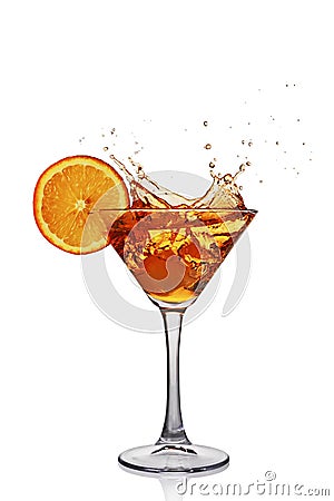 Splash in glass of transparent alcoholic cocktail drink with slice orange and ice Stock Photo