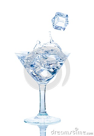 Splash from ice cube in a wine glass of water Stock Photo