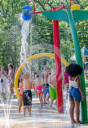 Splash pad and active children Editorial Stock Photo