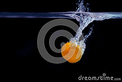 Splash of tangerine in water. freshness concept Stock Photo