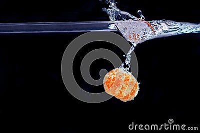 Splash of tangerine in water. freshness concept Stock Photo