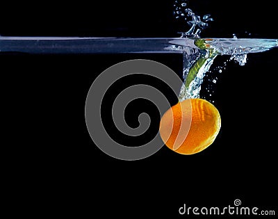 Splash of tangerine in water. freshness concept Stock Photo