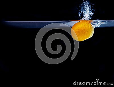 Splash of tangerine in water. freshness concept Stock Photo