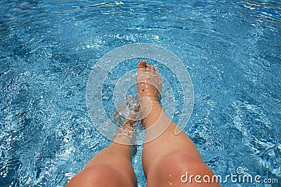 Splashing in the swimming pool Stock Photo