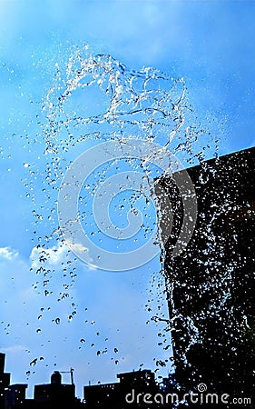 Splashing water isolated on blue background. Stock Photo