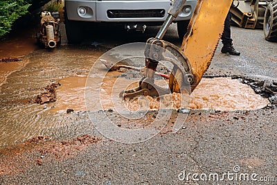 Splatter of water from broken pipe the main road Stock Photo