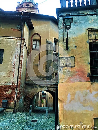 Splendid ancient street and colours in Saluzzo town, Piedmont region, Italy. History, enchanting architecture and art Stock Photo