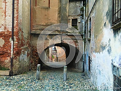 Splendid ancient street and colours in Saluzzo town, Piedmont region, Italy. History, enchanting architecture and art Stock Photo