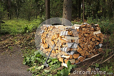 Split birch firewood stacked Stock Photo