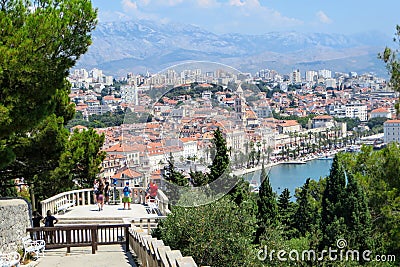 A group of tourists and locals admiring the beautiful faraway view of Split, Croatia from Marjan Hill on a sunny summer day. Editorial Stock Photo