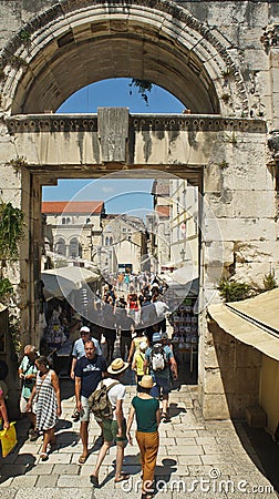 Split, Croatia - 07/22/2015 - People walking through Eastern Silver Gate, part of Diocletian Palace, sunny day, Dalmatia Editorial Stock Photo