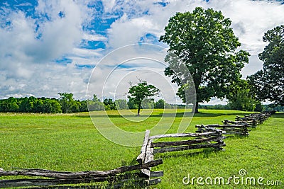 Split Rail Fence in a Field on a Beautiful Spring Day Stock Photo