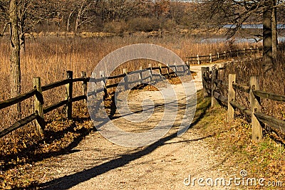 Split rail lined Gravel path at the Little Red Schoolhouse Nature Center Stock Photo