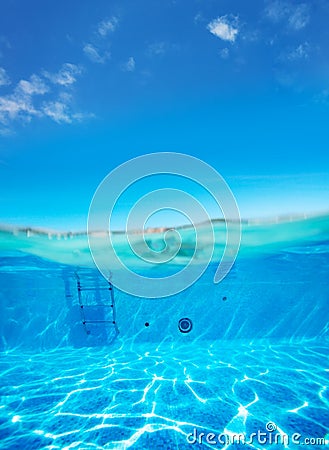 Split underwater pool photo of rails and ladder stairs Stock Photo