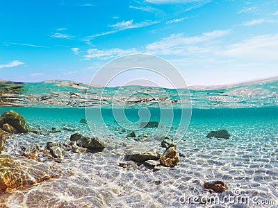 Split underwater view of Porto Istana shore Stock Photo